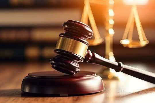 Judge's gavel and scales of justice representing a court ruling
