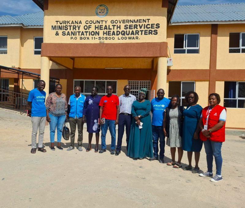 Turkana County health officials and development partners pose during a meeting on emergency health, nutrition and WASH services.