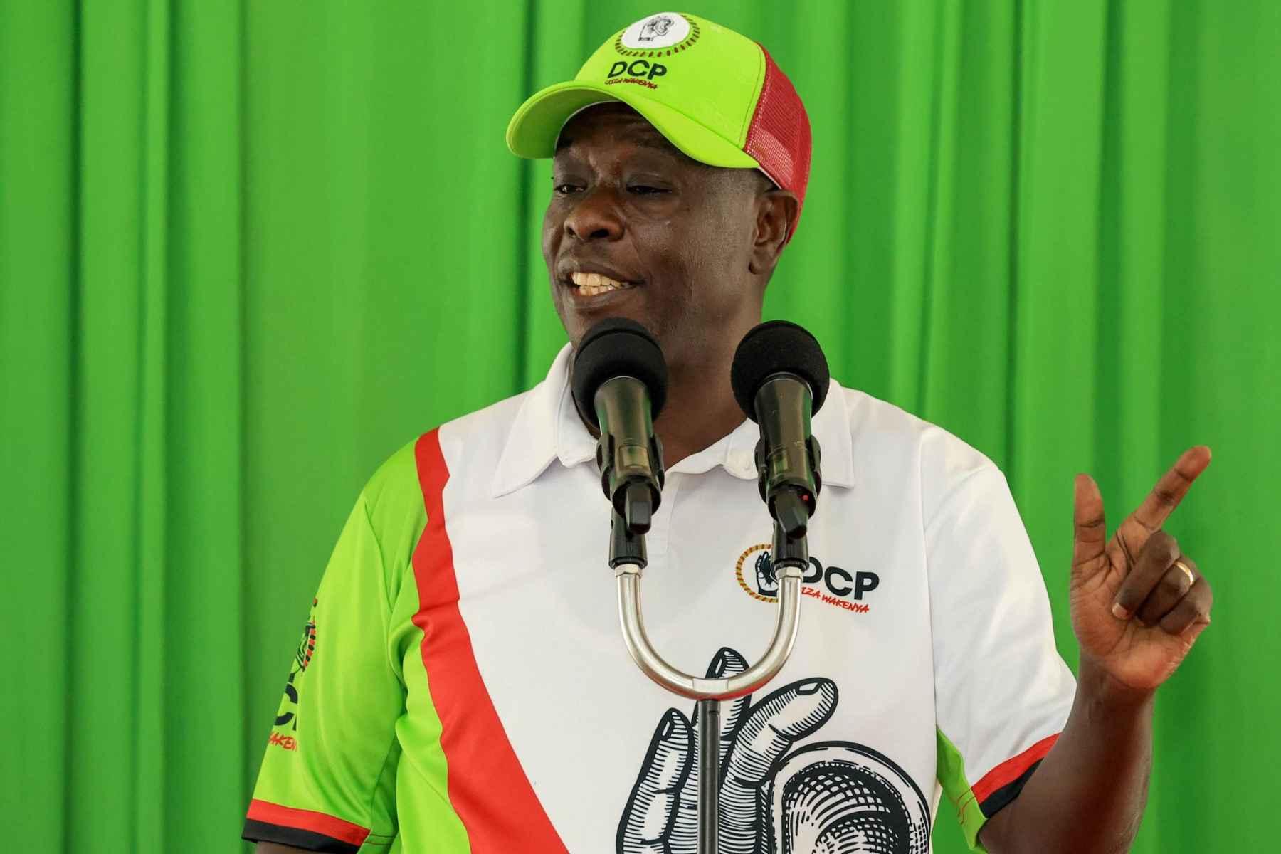Rigathi Gachagua speaks into microphones during a public address.