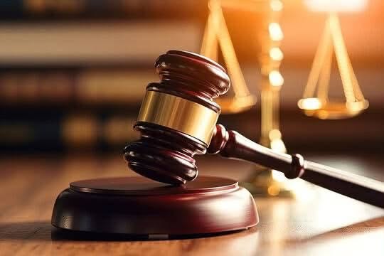 A judge's gavel and scales of justice representing court proceedings in a human trafficking case in Kajiado.