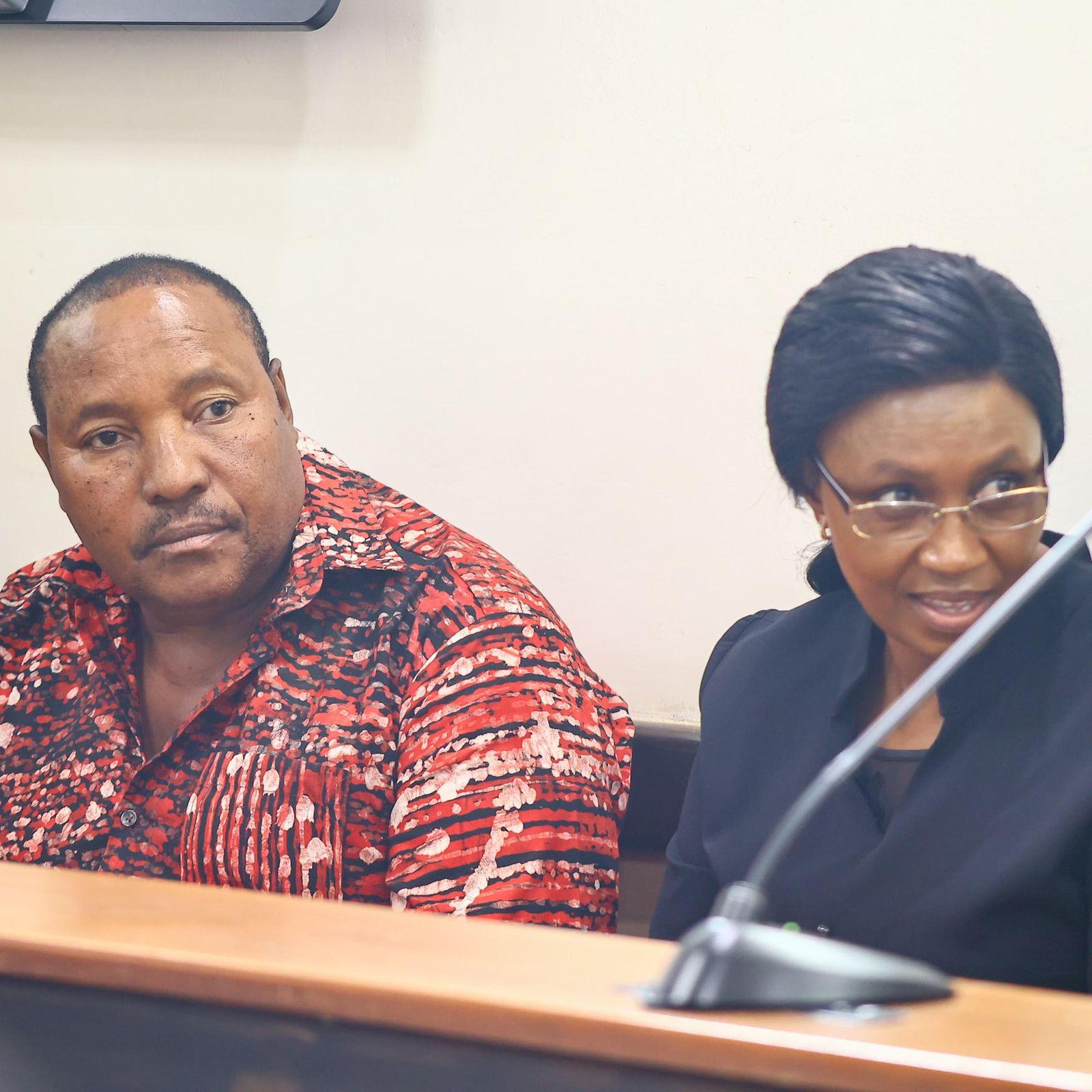 Ferdinand Waititu and his wife appear before a courtroom bench during proceedings in the corruption case.